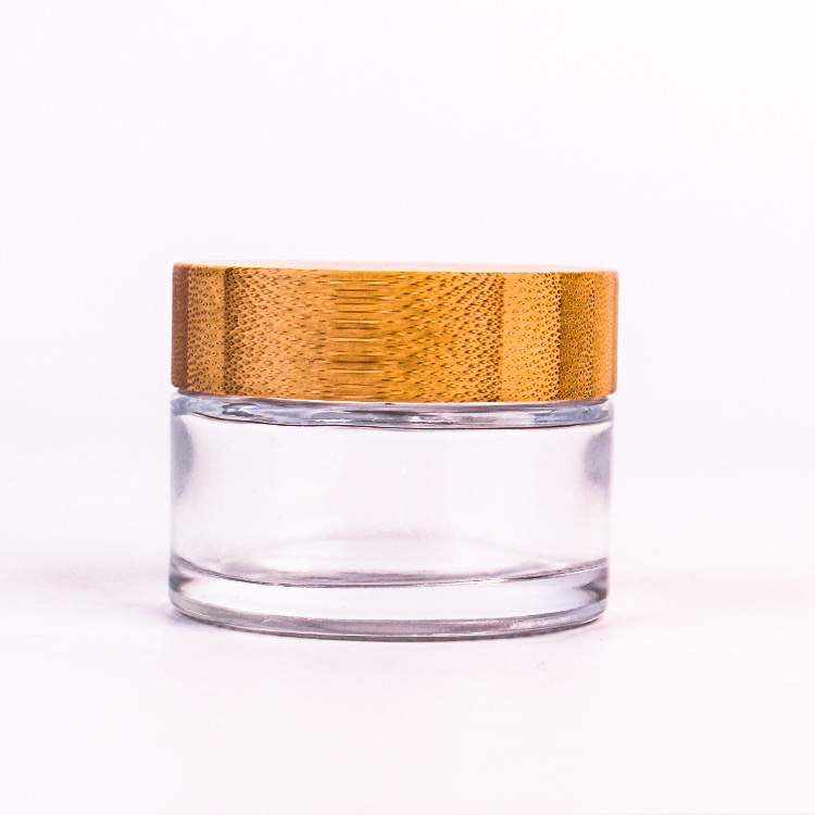 Récipient cosmétique en verre rond transparent de 60 ml avec couvercle en bambou