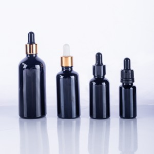 Black glass bottles for essential oils with dropper