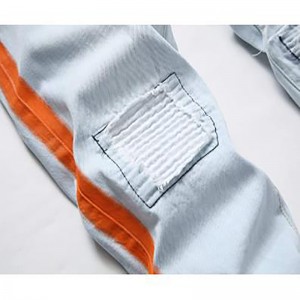 Hand-painted orange on the side ripped men’s jeans