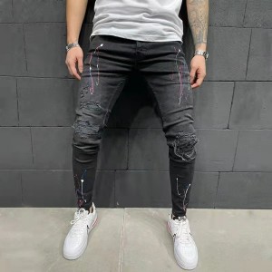 Hot selling straight leg pants spray paint toss ripped slim jeans
