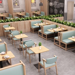 Moderna restavracija z usnjenim kavčem postavlja pohištvo za kavarno